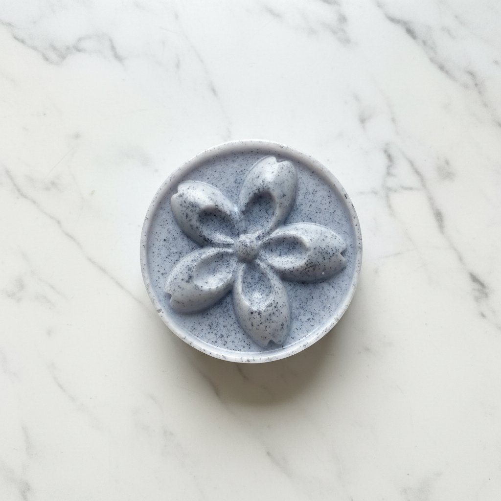 Round Goat Milk Flower Soap on white marble